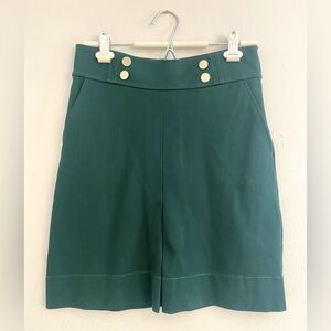 Green Skirt with Pockets and Gold Button Detail